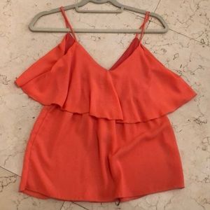 Tangerine colored tank with flattering ruffle